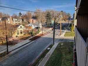 View of road featuring sidewalks, a residential view, and curbs