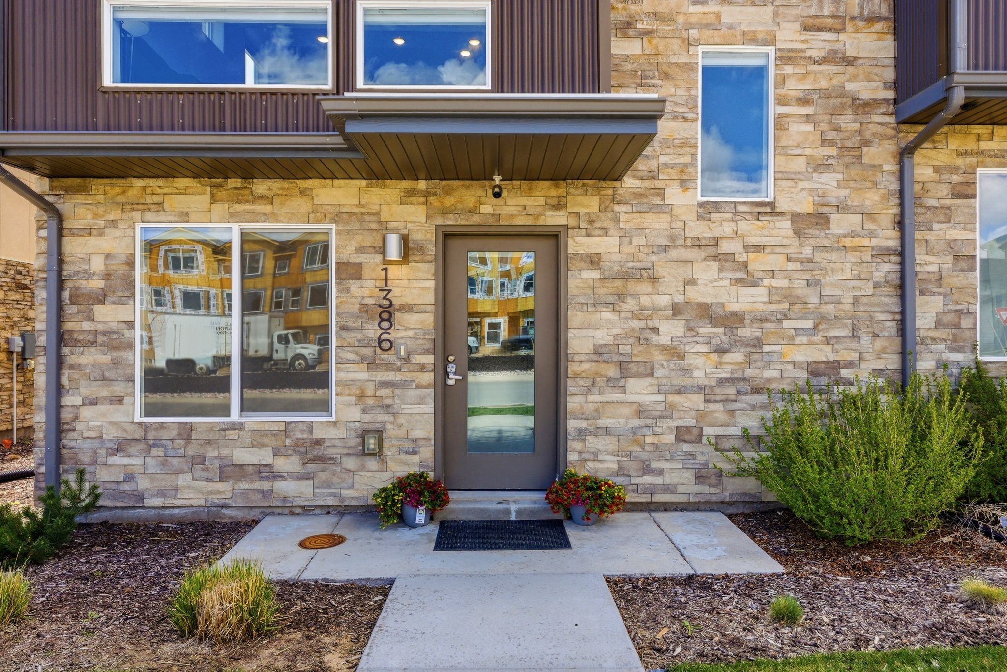 Property entrance featuring stone siding