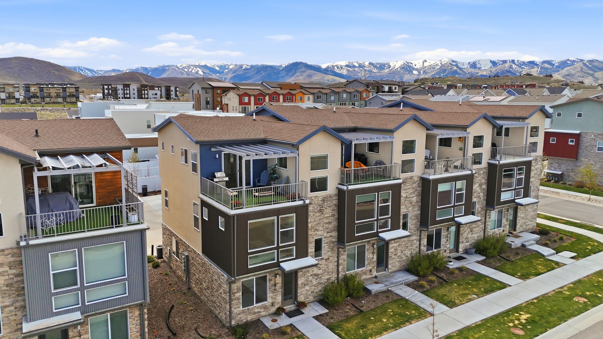 View of building exterior featuring a mountain view and a residential view