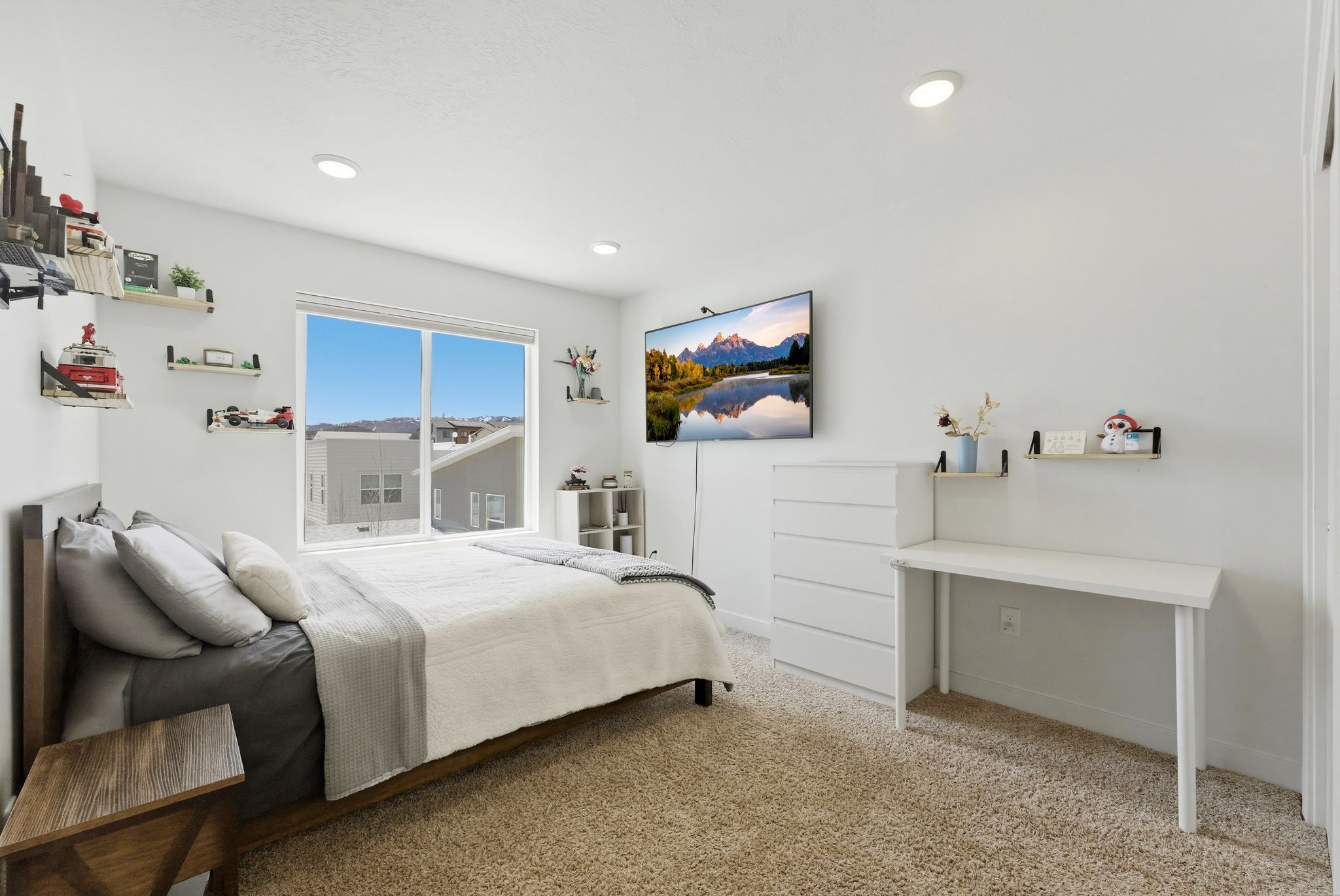 Bedroom featuring light carpet and baseboards