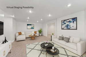 Living area featuring light colored carpet, a textured ceiling, and recessed lighting