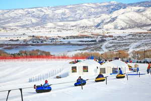 Snowy aerial view featuring a mountain view