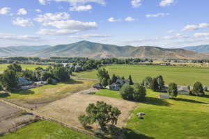 View of mountain backdrop featuring rural landscape