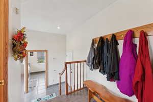 Mudroom with light tile patterned flooring and recessed lighting