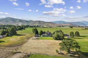 View of mountain background featuring rural landscape and agricultural land