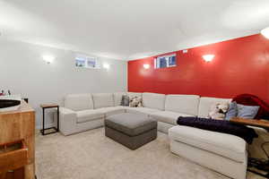 Carpeted living area featuring a textured ceiling