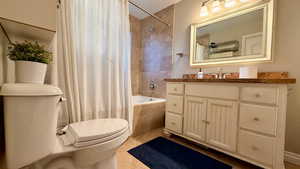 Bathroom featuring vanity and shower / tub combo