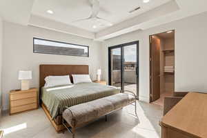 Bedroom featuring access to outside, a walk in closet, a ceiling fan, and recessed lighting