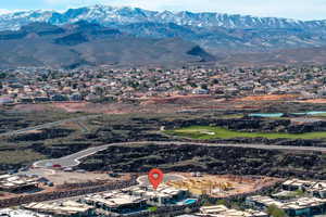 Aerial perspective of suburban area with a mountainous background