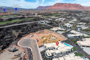 View of property location with mountains and nearby suburban area