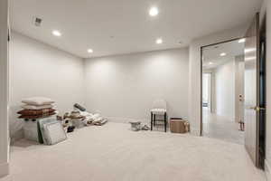 Miscellaneous room featuring recessed lighting and light colored carpet