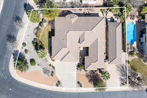 Aerial view of property and surrounding area with property boundaries highlighted and a pool area