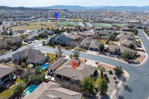 Aerial perspective of suburban area with a mountain backdrop