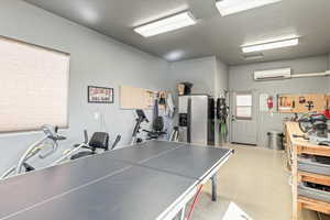 Game room featuring a mini split for heating / cooling
