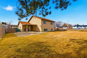 Back of house featuring a fenced backyard and a patio area