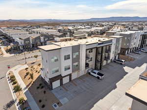 Aerial view of residential area featuring a mountain backdrop
