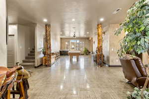 Building lobby with stairway and recessed lighting