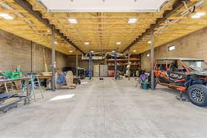 Garage with concrete block wall and a workshop area