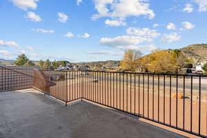 View of patio / terrace with a residential view and a mountain view