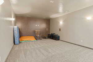 Interior space featuring carpet floors and baseboards