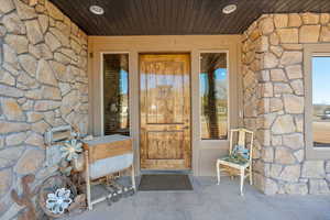 Property entrance with stone siding