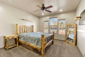 Bedroom with carpet flooring, a ceiling fan, and recessed lighting
