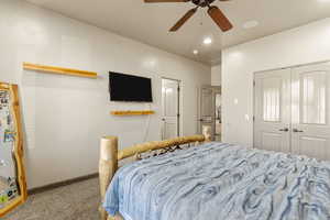 Bedroom featuring light carpet, a ceiling fan, a closet, and recessed lighting