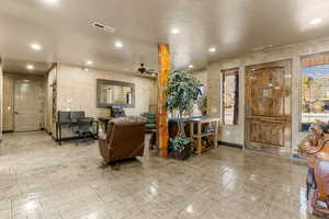 Foyer entrance with ceiling fan, recessed lighting, and plenty of natural light