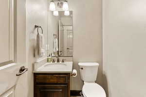 Bathroom featuring vanity and toilet