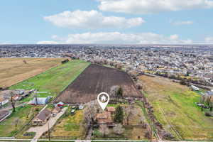Overview of rural landscape with farmland and nearby suburban area