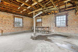 Misc room featuring brick wall