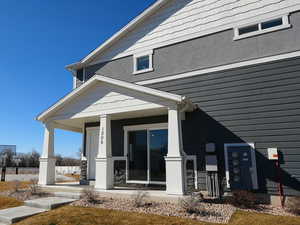 Entrance to property featuring a porch