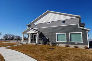 View of front of home featuring a porch and stucco siding
