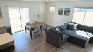 Living room with light wood-type flooring and plenty of natural light