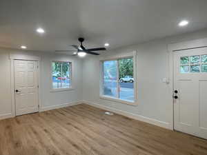 Foyer with light wood finished floors, a ceiling fan, and recessed lighting