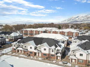 Snowy aerial view with a residential view