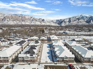 Snowy aerial view with a mountain view