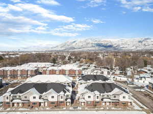 Snowy aerial view with a mountain view