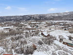 Snowy aerial view with a mountain view