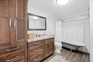Bathroom featuring vanity, light wood finished floors, and wooden ceiling