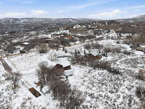 Snowy aerial view featuring a mountain view