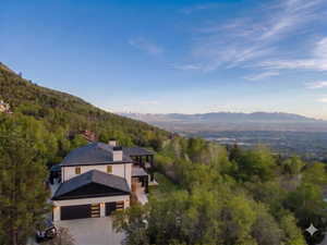 View of subject property featuring mountains