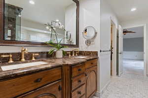 Bathroom with double vanity and recessed lighting