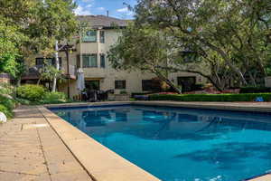 Swimming pool with a balcony and a patio area