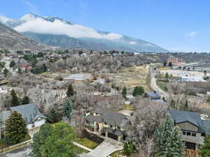 Aerial view of residential area featuring a mountainous background