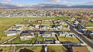 Aerial view of residential area featuring a mountainous background