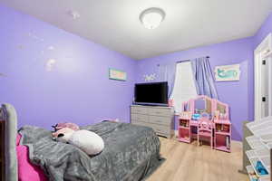 Bedroom featuring light wood finished floors