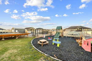 View of jungle gym featuring a sunroom and a residential view
