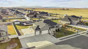 Aerial perspective of suburban area featuring a mountain backdrop