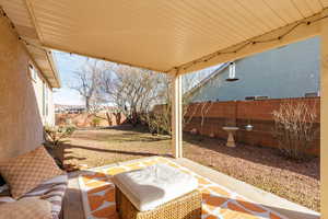 Fenced backyard with a patio area